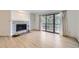 Open living room with a stone fireplace, and a glass door out to the deck at 3363 Oneal Pkwy # 36, Boulder, CO 80301