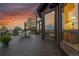 Expansive deck featuring outdoor seating and stunning sunset views, perfect for entertaining guests at 13954 Pine Country Ln, Conifer, CO 80433