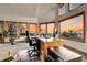 Bright office space with scenic sunset views through multiple windows at 13954 Pine Country Ln, Conifer, CO 80433