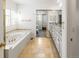 Spacious bathroom features a soaking tub, walk-in closet, and dual sink vanity at 8073 S Albion St, Centennial, CO 80122