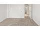 Neutral bedroom with closet, plush carpeting and bright light through windows and adjacent room at 8073 S Albion St, Centennial, CO 80122