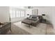 Inviting bedroom features ample natural light, neutral décor, ceiling fan, and decorative rug at 8073 S Albion St, Centennial, CO 80122