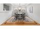 Charming dining room features hardwood floors, a stylish chandelier, and plantation shutters at 8073 S Albion St, Centennial, CO 80122
