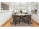 Elegant dining room with a round table, stylish chairs, a chandelier, and a large picture window at 8073 S Albion St, Centennial, CO 80122