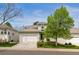 Charming two-story home featuring a tile roof, attached two car garage, and well-maintained landscaping at 8073 S Albion St, Centennial, CO 80122