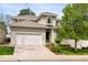 Charming two-story home featuring a tile roof, attached two car garage, and well-maintained landscaping at 8073 S Albion St, Centennial, CO 80122