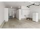 Spacious garage with storage cabinets, work area, and room for vehicles and projects at 8073 S Albion St, Centennial, CO 80122
