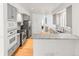 Open-concept kitchen with stainless steel appliances, gray cabinets, and granite countertops at 8073 S Albion St, Centennial, CO 80122