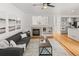 Spacious living room with fireplace, hardwood floors, and an open concept to the kitchen at 8073 S Albion St, Centennial, CO 80122