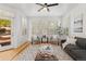 Inviting living room filled with natural light, hardwood floors, and a modern decor at 8073 S Albion St, Centennial, CO 80122