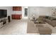 Open basement living room featuring neutral colors, comfortable seating, and a wet bar at 8073 S Albion St, Centennial, CO 80122
