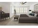 Tranquil main bedroom with a large window, neutral carpet, and elegant furnishings for a relaxing retreat at 8073 S Albion St, Centennial, CO 80122