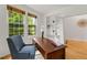 Bright office space features hardwood floors, natural light, and a comfortable chair at 8073 S Albion St, Centennial, CO 80122