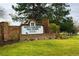 South Suburban Golf Course sign with brick accents and lush green lawn welcomes visitors at 8073 S Albion St, Centennial, CO 80122