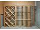 A wood wine rack provides stylish storage for wine bottles in this cellar at 8073 S Albion St, Centennial, CO 80122