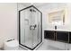 Modern bathroom featuring a glass shower enclosure and floating vanity sink at 3975 S Cherry St, Cherry Hills Village, CO 80113