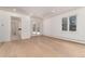 Bright bedroom with hardwood floors, white walls, and a view of the yard at 3975 S Cherry St, Cherry Hills Village, CO 80113