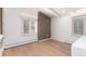Bright bedroom with hardwood floors, modern trim, and views of the yard at 3975 S Cherry St, Cherry Hills Village, CO 80113