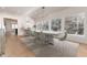 Dining room with modern chandelier, table with seating for six, and large windows at 3975 S Cherry St, Cherry Hills Village, CO 80113