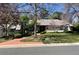Charming single-story home with well-maintained landscaping, mature trees, and a brick driveway at 3975 S Cherry St, Cherry Hills Village, CO 80113