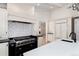 Well-equipped kitchen featuring custom cabinets, stainless steel appliances, and a large island with a sink at 3975 S Cherry St, Cherry Hills Village, CO 80113