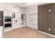 Bright kitchen featuring custom cabinets, modern appliances, and a large window at 3975 S Cherry St, Cherry Hills Village, CO 80113