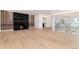 Spacious living room featuring hardwood floors, a fireplace, and abundant natural light at 3975 S Cherry St, Cherry Hills Village, CO 80113
