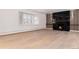 Light-filled living room offers a modern fireplace and beautiful hardwood flooring at 3975 S Cherry St, Cherry Hills Village, CO 80113