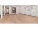 Open living room with hardwood floors, lots of windows, and natural lighting at 3975 S Cherry St, Cherry Hills Village, CO 80113