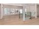 Open living room features hardwood floors, glass railings and large windows with lots of light at 3975 S Cherry St, Cherry Hills Village, CO 80113