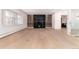 Spacious living room showcasing a modern fireplace, hardwood floors, and ample natural light at 3975 S Cherry St, Cherry Hills Village, CO 80113