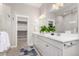 Bright bathroom features double sinks, a large mirror, and walk-in closet at 16762 Tejon Ln, Broomfield, CO 80023