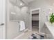 Modern bathroom featuring a glass-enclosed shower, walk-in closet and neutral color palette at 16762 Tejon Ln, Broomfield, CO 80023