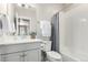 Bright bathroom featuring modern fixtures and a shower with a gray curtain at 16762 Tejon Ln, Broomfield, CO 80023