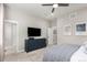 Bedroom with a ceiling fan, large windows, neutral color scheme, stylish furniture and modern decor at 16762 Tejon Ln, Broomfield, CO 80023