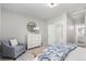 Inviting bedroom with sitting area, dresser, and a view to the bathroom at 16762 Tejon Ln, Broomfield, CO 80023