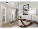 Inviting entryway with wood floors, decorative table, and art on the wall at 16762 Tejon Ln, Broomfield, CO 80023