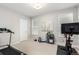 Home gym featuring workout equipment, neutral walls, and a ceiling light fixture at 16762 Tejon Ln, Broomfield, CO 80023