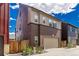 Exterior view of a two-story home featuring a two-car garage, fenced yard, and attractive contrasting trim at 16762 Tejon Ln, Broomfield, CO 80023