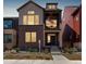 Two-story home with mixed siding, covered porch, and a walkway to the front door at 16762 Tejon Ln, Broomfield, CO 80023