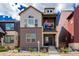 Two story home with a front porch and manicured landscaping at 16762 Tejon Ln, Broomfield, CO 80023