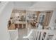Open-concept living area with a kitchen island, dining table, and stairs at 16762 Tejon Ln, Broomfield, CO 80023