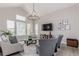 Vaulted living room with large windows, modern decor, and a sleek chandelier at 16762 Tejon Ln, Broomfield, CO 80023