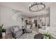 Open living area featuring a staircase, dining area, kitchen, and modern decor at 16762 Tejon Ln, Broomfield, CO 80023