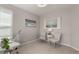 Cozy home office with a window, modern desk, decor, and two chairs at 16762 Tejon Ln, Broomfield, CO 80023