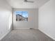 This bedroom has neutral walls and carpet with a ceiling fan and window at 7700 W Glasgow Pl # 10A, Littleton, CO 80128