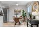 Modern dining area with a glass table, four chairs, and contemporary décor at 7700 W Glasgow Pl # 10A, Littleton, CO 80128