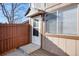 Front entrance of a home with a wooden fence at 7700 W Glasgow Pl # 10A, Littleton, CO 80128