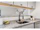 A kitchen view highlights granite counters, a matte black faucet, and appliances at 7700 W Glasgow Pl # 10A, Littleton, CO 80128