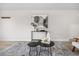 Stylish living room featuring modern art, sleek furniture, and a textured rug at 7700 W Glasgow Pl # 10A, Littleton, CO 80128